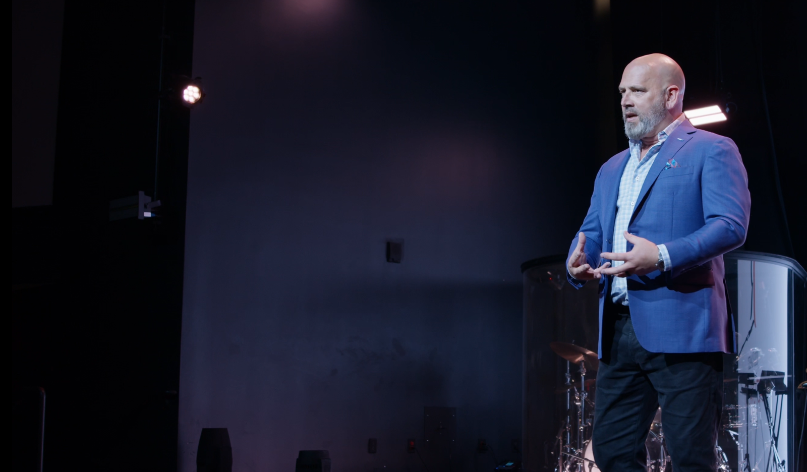 Joshua Ramsey speaking on stage